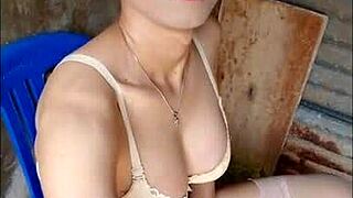 An amateur shemale masturbates nervously in open bathroom