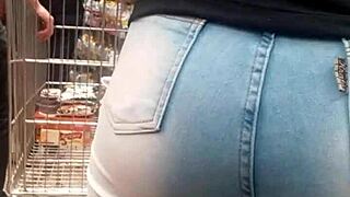 Brunette's juicy ass shakes in tight jeans at the market