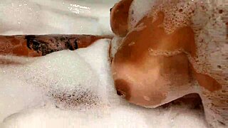 Tanned Stepsister Plays with Big Tits and Wet Pussy in Bathroom