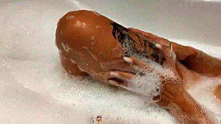 Tanned Stepsister Plays with Big Tits and Wet Pussy in Bathroom