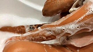 Tanned Stepsister Plays with Big Tits and Wet Pussy in Bathroom