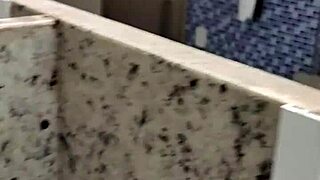 A man enters the public bathroom toilet for a solo handjob session outdoors amid amateur vibes