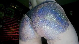 oiled big ass babe gets a shiny massage with colorful glitter sparkles
