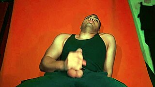 Bodybuilder Jerks Monster 18cm Cock on Guitar in Carrot Backdrop