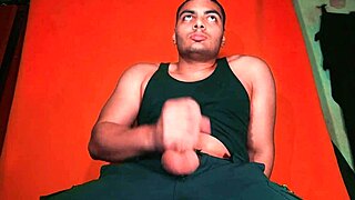 Bodybuilder Jerks Monster 18cm Cock on Guitar in Carrot Backdrop