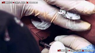 Amina Sky endures extreme asshole tattoo session close-up