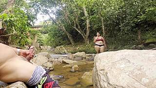 hey this unknown lady jerks me off in the river then milks her big tits