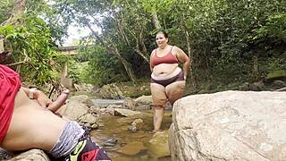 hey this unknown lady jerks me off in the river then milks her big tits