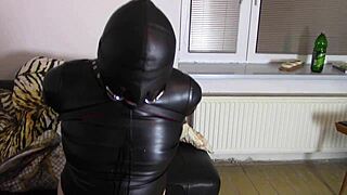 crossdresser katja drools bound in tight leather hood bondage