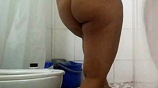 Horny brunette soaks the bathroom masturbating legs spread till screaming orgasm hits