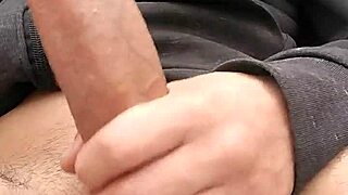 dude casually jerks his monster cock outdoors till it explodes with cum