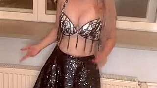 Belly dancer moneyarmany releases version 3 song on september 3 2024 as findom goaldigger with long nails and glasses.