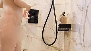 Japanese black-haired cutie bathes in steamy shower