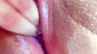 Close-up fingers penetrate wet vagina deeply