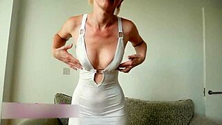 Blonde slips into short tight white dress with stockings and heels