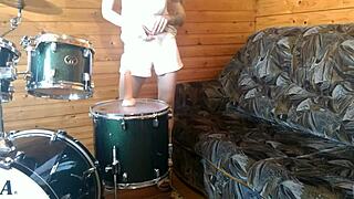 petite teen rams big dildo deep in shaved pussy on drumset