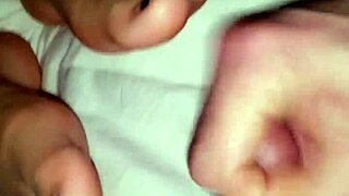 Cum explodes on feet while she strokes?