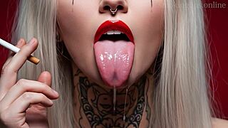 She puffs devilish smokes in her lipstick fetish monster tease