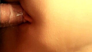 shaved fuck doll's hairless pussy grips tight with lube for double penetration toy fun
