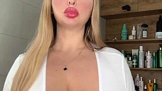 A mature milf caresses her huge natural saggy tits waiting seductively for action