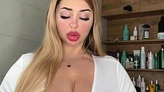 A mature milf caresses her huge natural saggy tits waiting seductively for action
