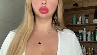 A mature milf caresses her huge natural saggy tits waiting seductively for action