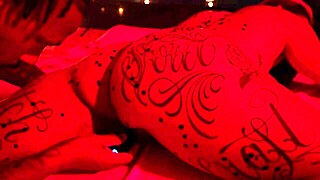 redhead and muscular partner explore waxplay in an interracial setting