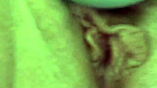 granny uses vibrator in close up