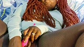 Ebony milf spreads legs for toy masturbation