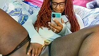 Ebony milf spreads legs for toy masturbation