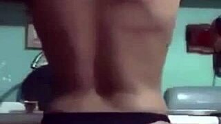 The hot latina undresses slowly, her big tits exposed as clothes rip during striptease.