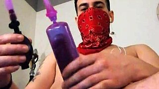 She strokes her big toy alone in stockings with tattoos