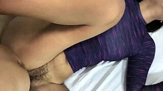 Surfer girl latina bent over on beach