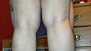 riding a 14 inch dildo in a steamy session with intense pleasure.