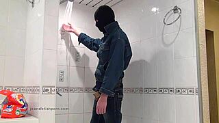 The Master In Blue Jeans Washes Himself In The Bath, Barefoot And Clothed.