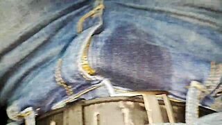 Woman pees inside her car in detailed view