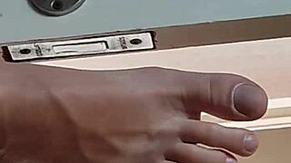 close up of big cock and feet in amateur homemade scene.