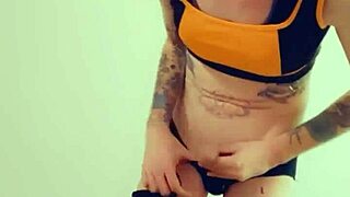 in lingerie, the hot transsexual rubs her clitty while fantasizing about cock and masturbation.