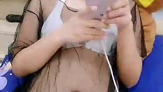 Is this Asian stripper teasing with seductive moves?