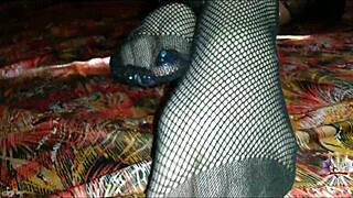 she jerks your cock with tattooed feet