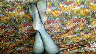 she jerks your cock with tattooed feet