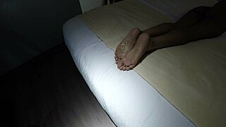 mandy mynxx gives a footjob to her lover in this fetish video