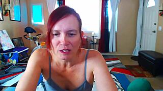 Redhead milf performs full body stretching in yoga shorts barefoot