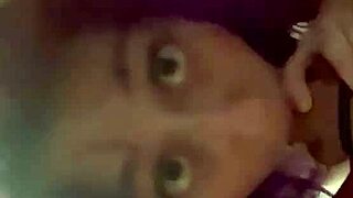 the purple haired girl performs a blowjob on the cock