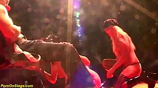 Wild lesbian action unfolds on a public stage.