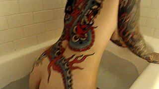 Tattooed girl in her final bath show