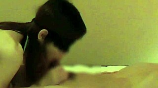 In a cozy bedroom, a beautiful Chinese girlfriend teases with handjob and blowjob. She brings him to climax.