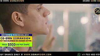 The blonde babe is giving a blowjob to the black-haired one at ggmansion.