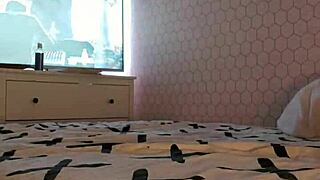 sitting firmly on the large seat in the room