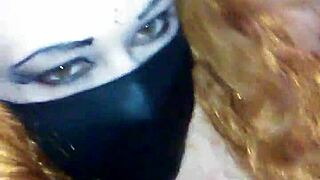 Bound girl masturbates with black dildo under mask 😈